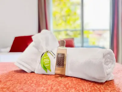 a towel and a bottle of soap on a table at Le TerrAzur - Logement 4 personnes Cannes in Cannes