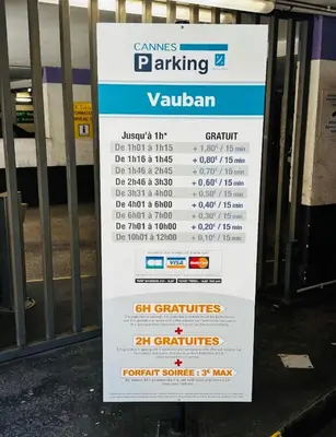 a parking sign in front of a gate at Le BlueAzur - Proche Palais centre Cannes in Cannes