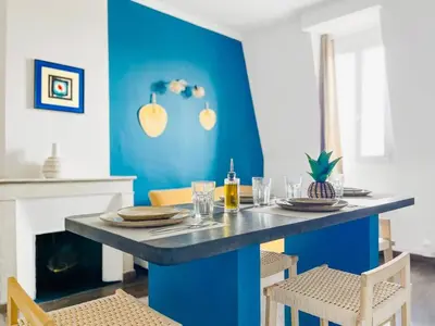 a blue dining room with a table and chairs at Le BlueAzur - Proche Palais centre Cannes in Cannes