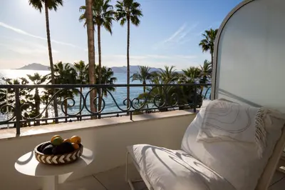 a balcony with a bowl of fruit on a table at Modern 1-bedroom apartment with sea view on La Croisette in Cannes