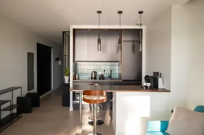 a kitchen with a wooden counter top in a room at Modern 1-bedroom apartment with sea view on La Croisette in Cannes