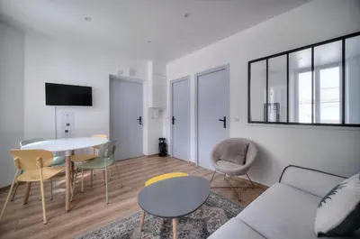a living room with a couch and a table at Elégant 2 pièces TERRASSE, SUQUET-CENTRE HISTORIQUE A1B261 in Cannes