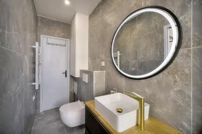 a bathroom with a sink and a mirror at Elégant 2 pièces TERRASSE, SUQUET-CENTRE HISTORIQUE A1B261 in Cannes