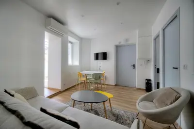 a living room with a couch and chairs and a table at Elégant 2 pièces TERRASSE, SUQUET-CENTRE HISTORIQUE A1B261 in Cannes