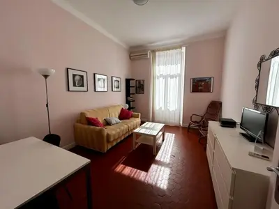 a living room with a couch and a table at A004 - Bright apt Rue d'Antibes at 300m from beach Croisette in Cannes