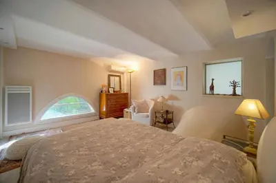 a bedroom with a bed and a window at Valbois in Cannes