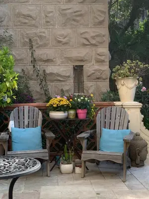 two chairs and a table with flowers and plants at Valbois in Cannes