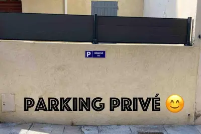 a wall with a parking prize sign on it at Appartement familial, lumineux, calme avec parking in Cannes