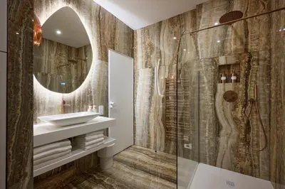 a bathroom with a sink and a mirror at Le XV Cannes in Cannes