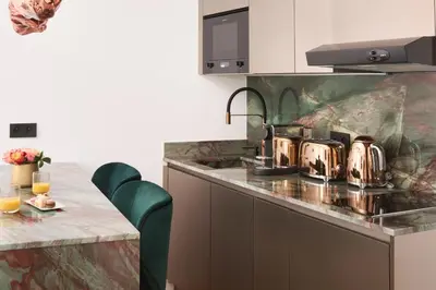 a kitchen with a counter with pots and pans on it at Le XV Cannes in Cannes