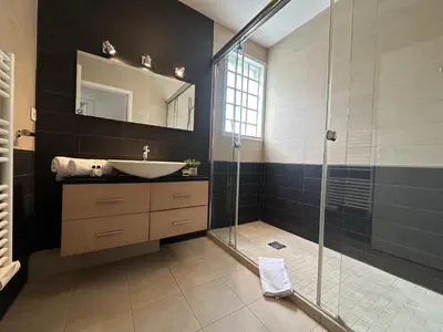 a bathroom with a sink and a glass shower at Charmant 2P Cannes PEL1900 in Cannes