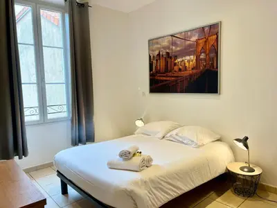 a bedroom with a bed with two towels on it at Viva Riviera Residence Rue Florian close Croisette in Cannes