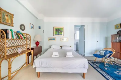 a bedroom with a bed and a desk and a chair at A056 - Nice Studio Cannes centre with parking in Cannes