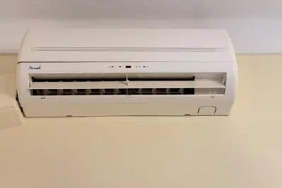 a white printer sitting on top of a wall at Beautiful 2-bedroom apartment - near the Palais and the beaches in Cannes