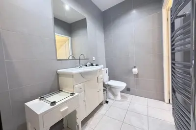 a bathroom with a sink and a toilet at Beautiful 2-bedroom apartment - near the Palais and the beaches in Cannes