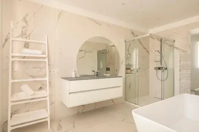 a white bathroom with a sink and a shower at Villa California Cannes Private Pool in Cannes