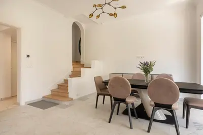 a dining room with a table and chairs at Villa California Cannes Private Pool in Cannes