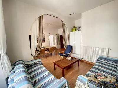 a living room with a couch and a table at en centre ville magnifique pied a terre ran44 in Cannes
