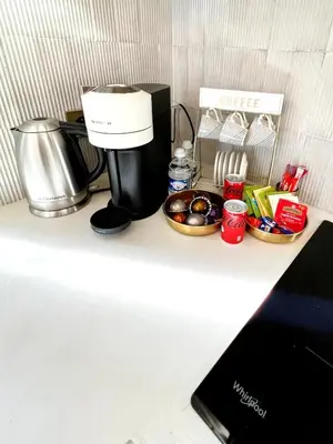 a coffeemaker sitting on top of a kitchen counter at Palais Croisette Plage - 45 m2 Luxe - 2 Balcons in Cannes