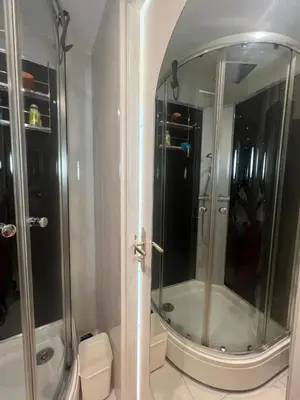 a bathroom with a shower with a mirror at Sea view Croisette in Cannes