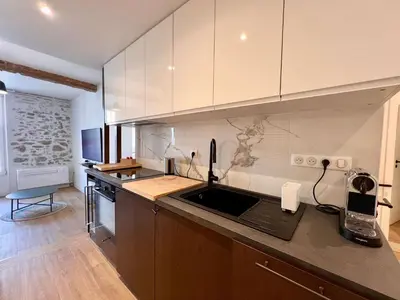 a kitchen with a sink and a counter top at B066 Studio design à 5 mn de la plage in Cannes