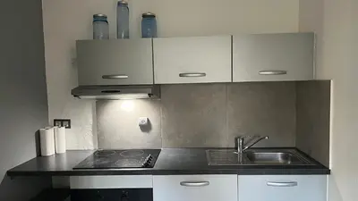 a kitchen with a sink and a counter top at Appartement studio Cannes in Cannes