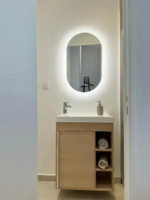 a bathroom with a sink and a mirror at Charming appartement 3BR - 3BA - 3WC in Cannes