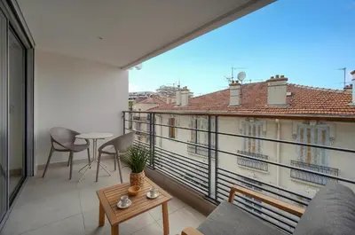 a room with a balcony with a table and chairs at Sublime Studio TERRASSE, Edith Cavell- proche CROISETTE A0B196 in Cannes