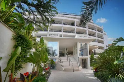 a white apartment building with stairs and plants at Sublime Studio TERRASSE, Edith Cavell- proche CROISETTE A0B196 in Cannes