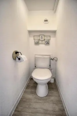 a bathroom with a white toilet in a room at Eva - Piscine - Terrasse - VCA in Cannes