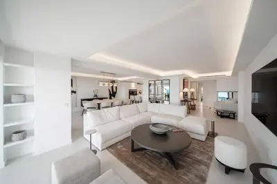 a living room with a white couch and a table at Charming oasis with terrace 4 BD- 8P - Cannes in Cannes