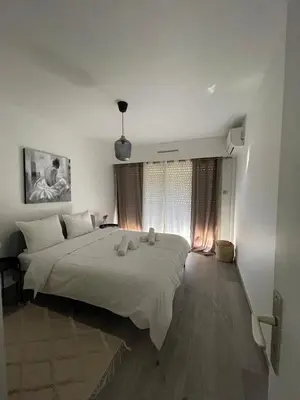 a bedroom with a large bed in a room at Riad by L'Oliveraie in Cannes
