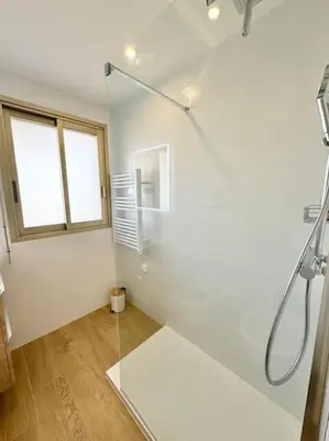 a bathroom with a shower with a glass door at Le studio Palm Beach, Clim ,Parking, Neuf in Cannes