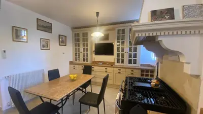 a kitchen with a table and a stove top oven at Cannes - proche des plages de la célèbre Croisette in Cannes