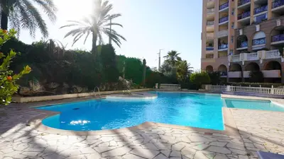 a large swimming pool in front of a building at Appartement 426, vue mer et piscine by Palmazur in Cannes