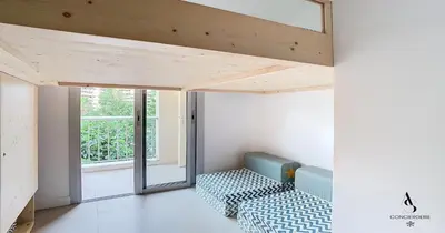 a room with two chairs and a window at Les Genêts - 2 chambres - Terrasse - Climatisé in Le Cannet