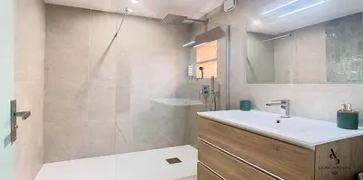 a bathroom with a sink and a shower at Les Genêts - 2 chambres - Terrasse - Climatisé in Le Cannet