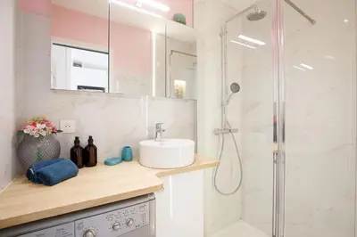 a bathroom with a sink and a shower at Cannes-vue mer Esterel-balcon-Plage in Cannes