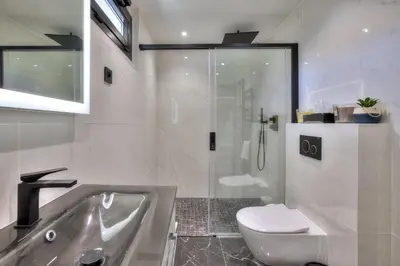 a bathroom with a shower and a toilet and a sink at Luxury 4 Stars Apt Croisette in Cannes