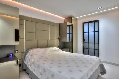 a bedroom with a large bed and a window at Luxury 4 Stars Apt Croisette in Cannes