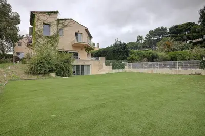 a large yard in front of a house at Twin Luxurious Villas 8 BR Pool in Vallauris in Vallauris