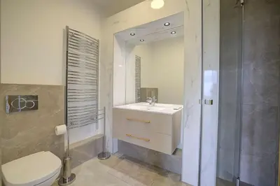 a bathroom with a toilet and a sink and a shower at Twin Luxurious Villas 8 BR Pool in Vallauris in Vallauris