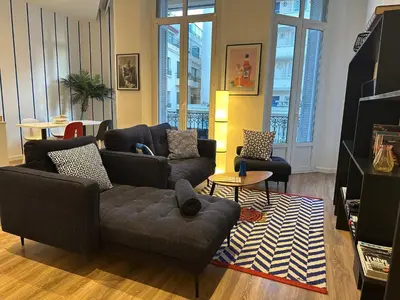 a living room with two couches and a table at Dolce Cannes Riviera Cannes in Cannes
