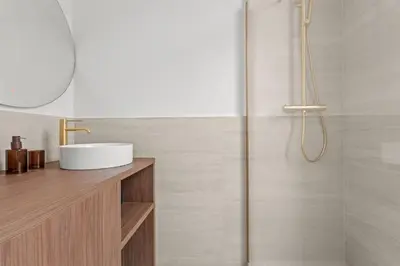 a bathroom with a sink and a shower at LB Vacation Rentals I Renovated Apartment Min from Beach and Palais in Cannes