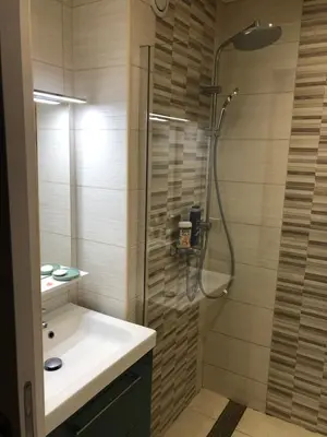 a bathroom with a sink and a shower at Quiétude in Cannes