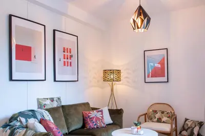 a living room with a couch and a table at C8 - Lovely House Cannes 4 BDR - Pool, AC, Garage & Wifi in Cannes
