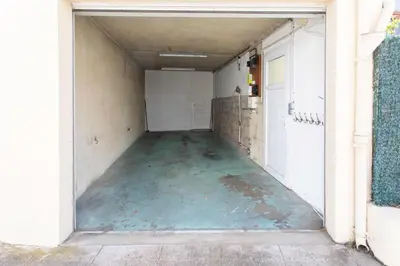 an empty hallway of a building with a garage at C8 - Lovely House Cannes 4 BDR - Pool, AC, Garage & Wifi in Cannes