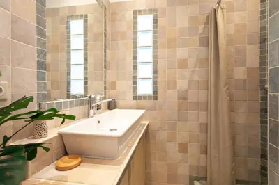 a bathroom with a sink and a shower at C8 - Lovely House Cannes 4 BDR - Pool, AC, Garage & Wifi in Cannes