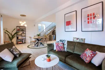 a living room with two couches and a table at C8 - Lovely House Cannes 4 BDR - Pool, AC, Garage & Wifi in Cannes