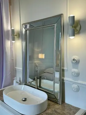 a bathroom with a white sink and a mirror at Maison LYO logement Luxe in Cannes